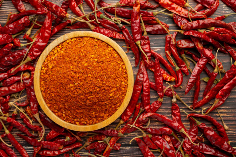 cayenne dried pepper in small wooden plate