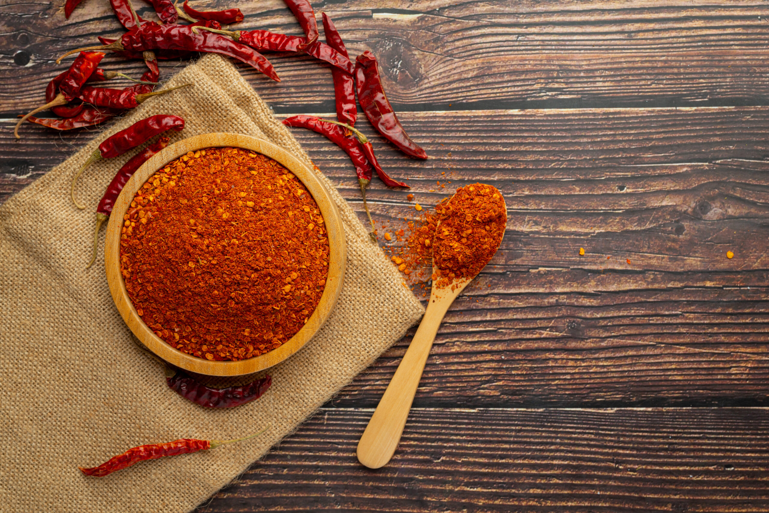 cayenne dried pepper in small wooden plate